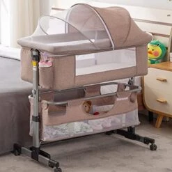 Cuddor Bedside Bassinet For Baby, Bedside Sleeper With Wheels, Heigt Adjustable, With Mosquito Nets, Large Storage Bag, For Infant/Baby/Newborn - Pink -Delta Children Shop 5100gtBLBXL. AC